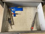 a box with tools inside of it on the floor