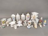 many different types of porcelain vases on the table