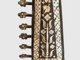 a wooden instrument that is sitting on a stand