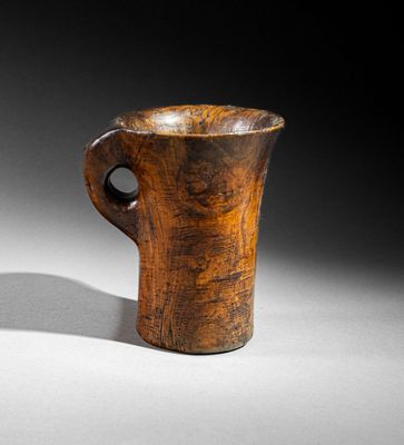 pair of wooden vases with handles on a white surface