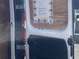 a white van with the door open in a parking lot