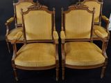 pair of antique french carved wood chairs with yellow upholstered cushions