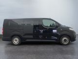a black van that is parked on the side of the road