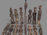 an image of a group of wooden figurines sitting on top of a table