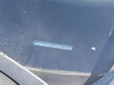 a blue sticker on the windshield of a car