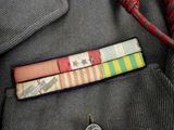 an image of a military uniform with a medal in the pocket