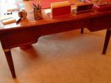 a desk with a chair and a chair in the room