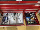 a red tool box with tools inside of it