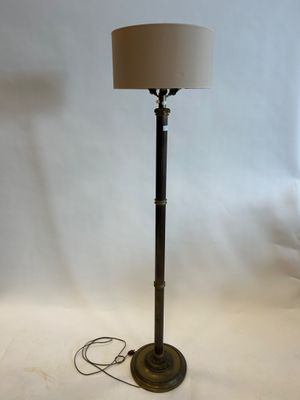 a lamp that is on a table with a lamp on it