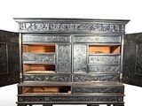 an old wooden cabinet with two doors open