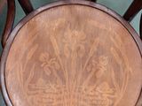 a wooden chair with a wooden seat on the floor