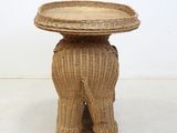 an image of a wicker elephant table with a tray on top