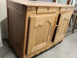 a wooden cabinet with two doors on top of it