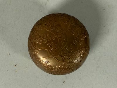 an image of a gold locke on a white surface