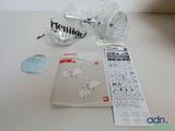 a picture of a picture of a manual and parts on the table