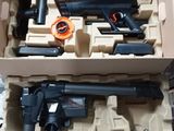 a box with a gun and other items in it