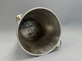 a silver cup that is sitting on a table