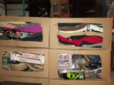a cardboard box filled with assorted items in a garage