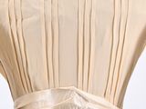 the back of a woman ' s dress on a mannequin mannequin mannequin mannequin mannequin mannequin mannequin mann