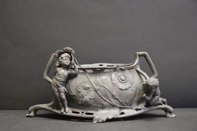 a statue of a man and a dog in a bathtub