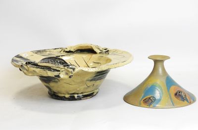 two vases sitting next to each other on a white surface