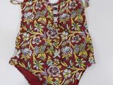a bathing suit with a floral print on it
