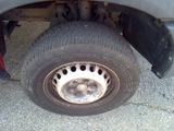 a close up of a flat tire on a truck