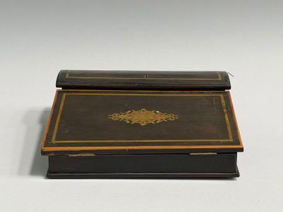 a black box with a gold decoration on it