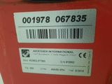 a label on the back of a red fire hydrant