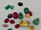 assorted gems on a white surface with a white background