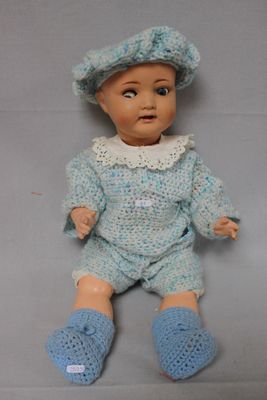 a small doll that is sitting on a table