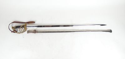 a close up of a sword with a wooden handle on a white surface
