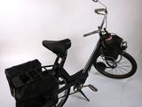 a black bicycle with a basket on the back of it