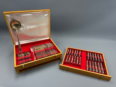 a wooden box with a set of silverware in it