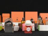 many different types of perfume bottles on a table