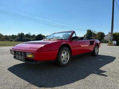 an image of a red sports car parked in a parking lot