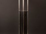 a black and white table lamp on a wooden surface