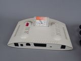 a nintendo wii game console with a controller and a game pad