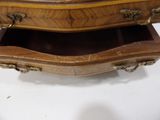 a wooden table with a drawer on top of it