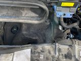 a picture of a car engine with its hood open