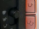 a close up of a remote control with a smiley face drawn on it