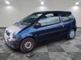 a picture of a small blue car parked in a garage