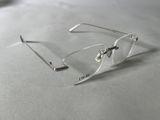 a pair of glasses sitting on top of a table