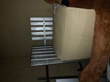a large teddy bear that is sitting on a bench