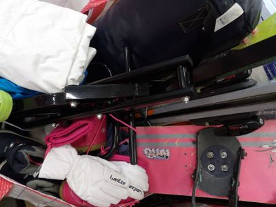 a pile of luggage sitting on top of a luggage cart