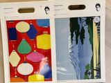 the two boxes are open on the table with a picture of a man and a woman on them