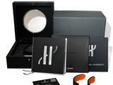an image of a black box with a magnifying glass and a book