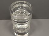 a glass of water sitting on a table