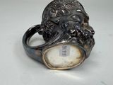 a silver ring with a lion head on top of it