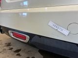 a sticker on the back of a car that is parked in a garage